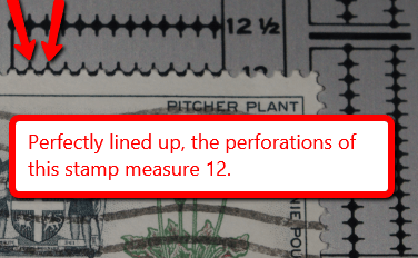 A stamp lined up on a perforation gauge